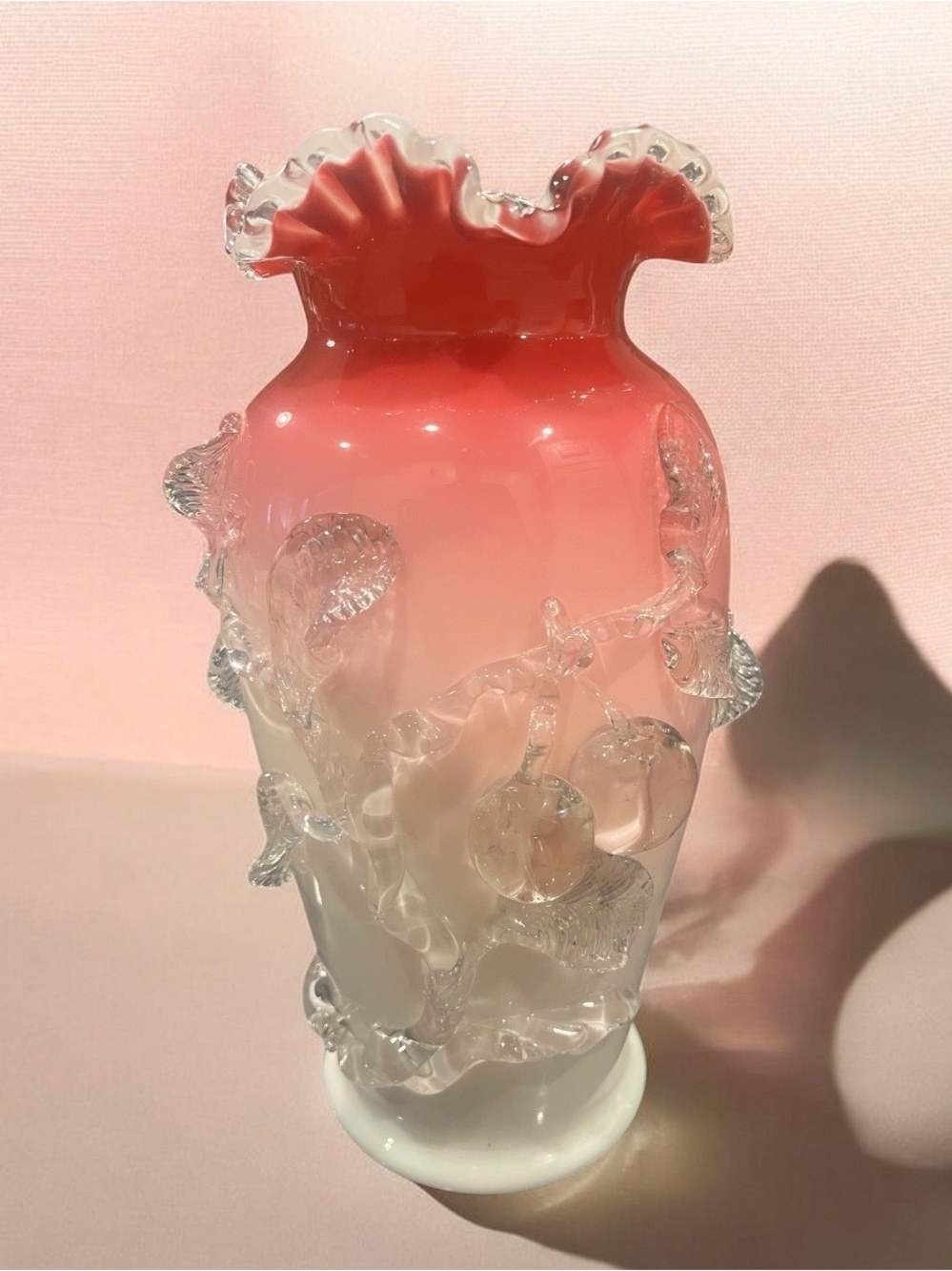 Victorian art glass vase with Peachblow coloration and applied cherry motif.